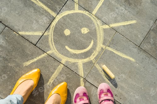 Preview: yellow sun and feet of woman and child