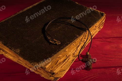 Preview: Very old ancient holy bible and neckalce cross.