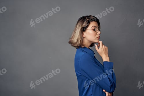 Vista previa: woman in blue shirt wearing glasses elegant style isolated background
