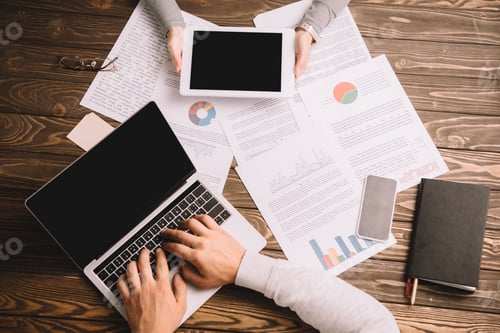 Preview: top view of businesspeople working with digital devices and documents