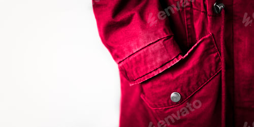 Preview: Clothing element with pockets close-up. Copy space banner with textile in color of the year