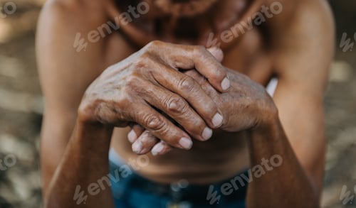 Preview: Close up of male wrinkled hands, old man is wearing