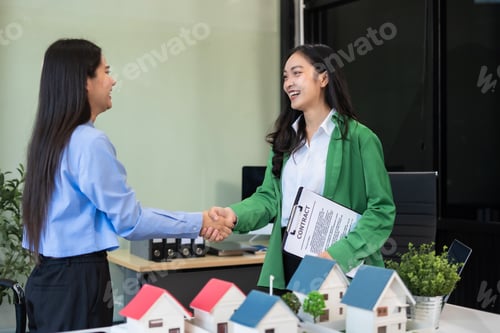 Preview: Close up shake hands, Considering buying a home, investing in real estate.