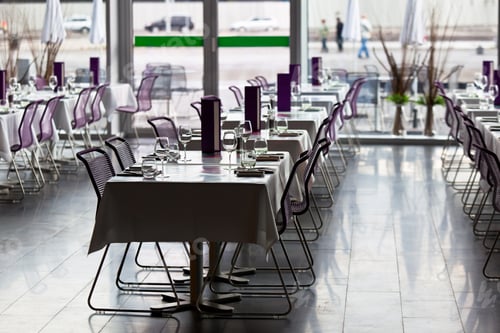 Preview: Indoor restaurant tables ready for service