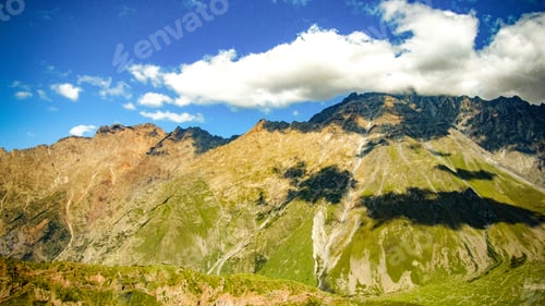 Preview: Beautiful panoramic view from the grassy hill to the Kazbek mountains.