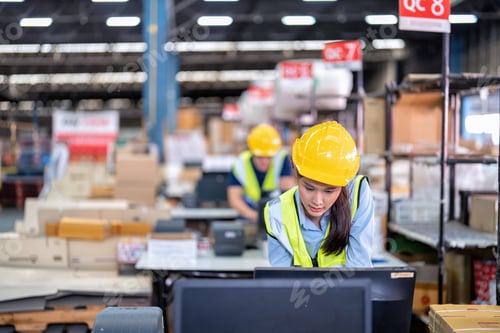 Preview: Worker working in the large depot storage warehouse concentrate check stock at cashier counter