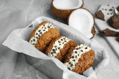 Preview: Sweet delicious ice cream cookie sandwiches with chocolate chips served on table
