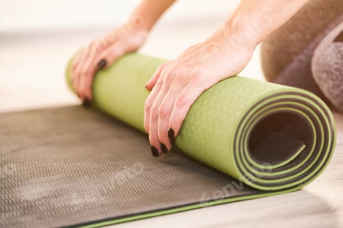 Preview: Preparing for Yoga Session with a Green Mat