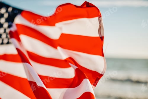 Preview: Usa national America flag at seaside background as symbol of democracy us memorial day 4th of july
