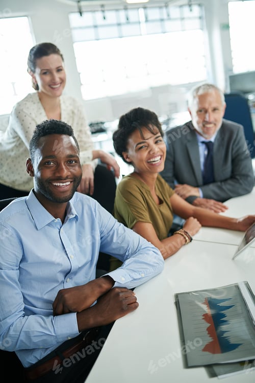 Preview: Its been a great day at the office. Portrait of a group of coworkers sitting together in an office.