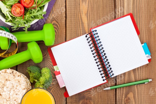 Preview: Dumbells, tape measure, healthy food and notepad for copy space.