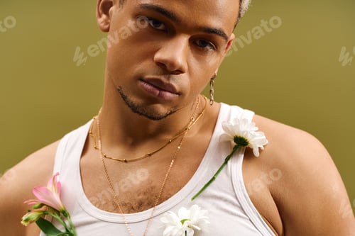 Preview: Trendy young man with dyed hair showcases floral style in studio setting