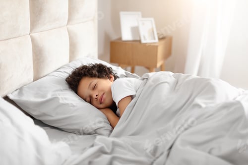 Preview: Little Boy Sleeping in Bed With White Comforter