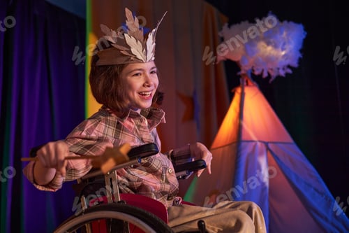 Preview: Smiling Girl in Wheelchair Wearing Costume Acting on Stage of Childrens Theater