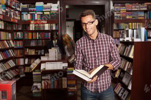 Preview: young attractive guy in a bookstore
