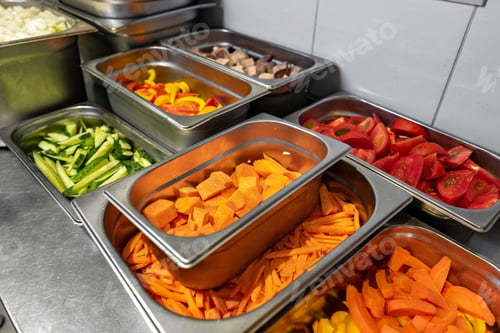 Preview: Stainless steel food trays on counter in professional kitchen