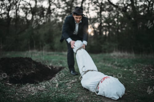 Preview: Slayer drags the victim's body into a grave