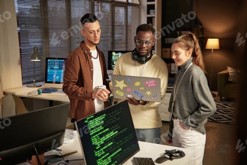 Preview: Developers Launching Program on Laptop