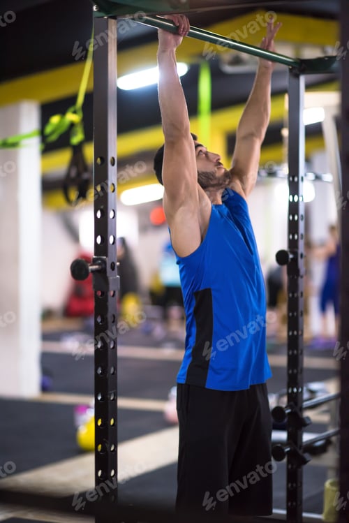 Preview: man doing pull ups on the horizontal bar