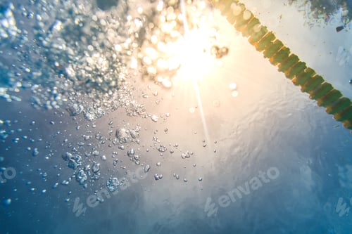 Preview: Danger of Drowning Concept with Air Bubbles and rays of Sun Ligh