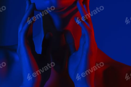 Preview: Young woman touching her chin with her hands