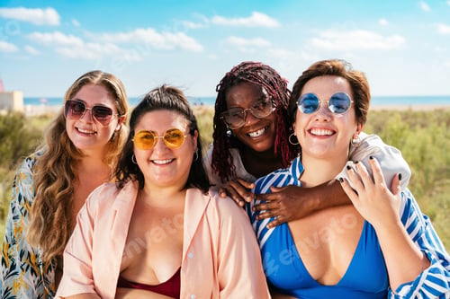 Preview: Group of plus size women with swimwear at the beach