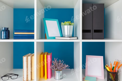 Preview: White office shelves with different stationery, close up
