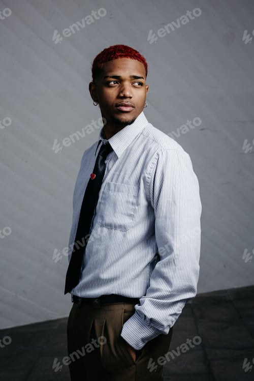Preview: Stylish portrait of a pensive black man dressed in office attire