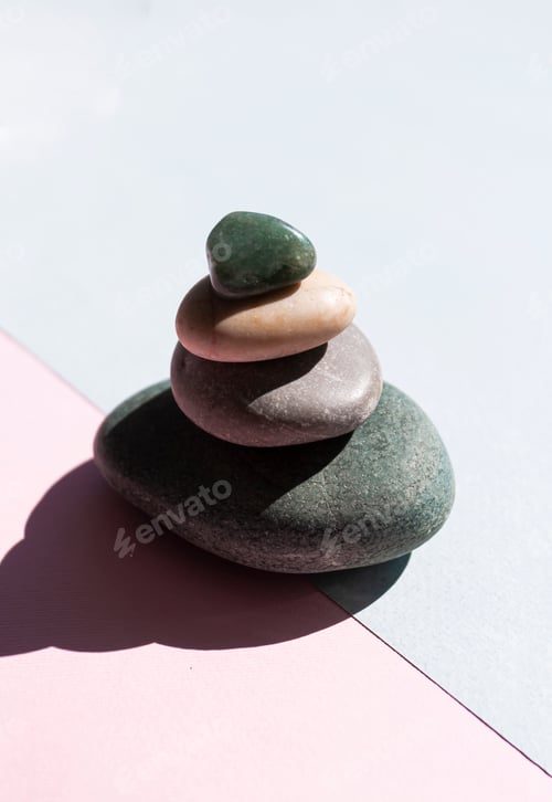 Preview: Stone mountain on a blue and pink background, a tower of four stones