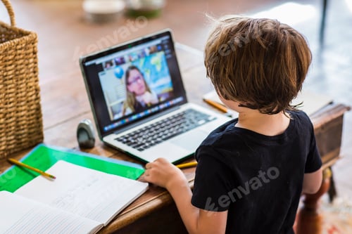 Preview: Child Attends Virtual Class at Home On Computer