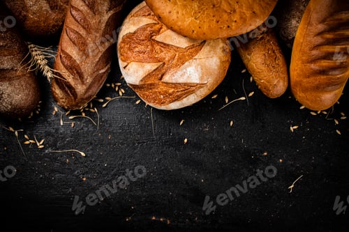 Preview: Different types of fresh bread on the table.