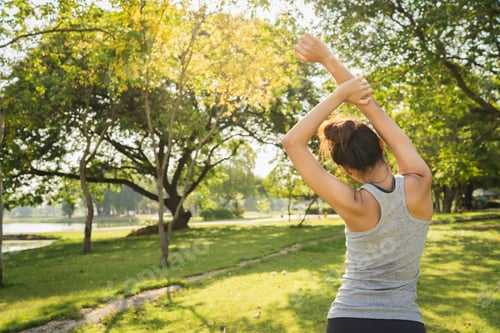 Preview: Asian runner woman warm up her body by push up before exercise and yoga near lake at park.