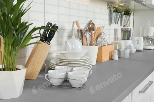 Preview: Clean dishes and utensils on kitchen counter