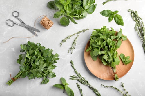 Preview: Flat lay composition with fresh green herbs on grey background