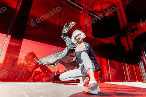 Preview: Stylish blonde on a red background.