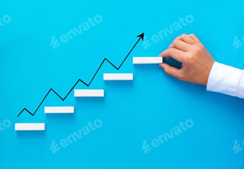 Preview: Businessman hand arranging wood block stacking as step stair with growth arrow. Business growth suc