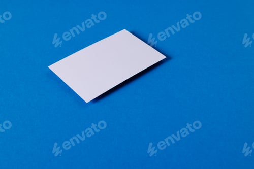 Preview: White business card with copy space on blue background