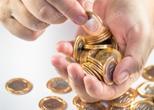 Preview: Man counting his savings, putting the Brazilian real coins on a white background