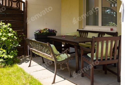 Preview: Terrace on the ground floor of the apartment with a seating area