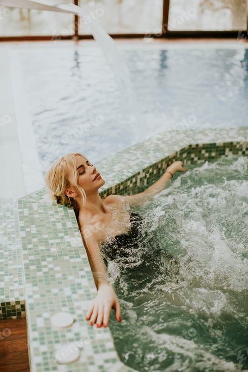 Preview: Young woman relaxing in the whirlpool bathtub