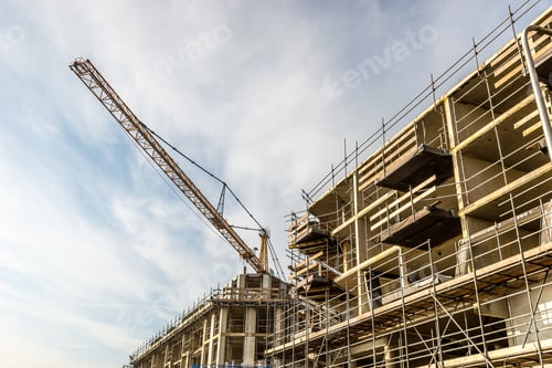 Preview: New buildings being constructed in a suburban area with the help of the cranes