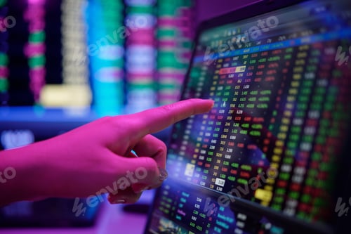 Preview: Finger Pointing at Stock Market Data on Monitor