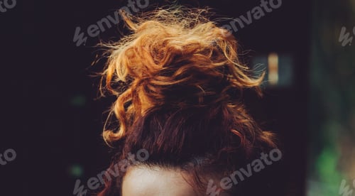 Preview: Close Up of Woman's Curly Orange and Brown Hair