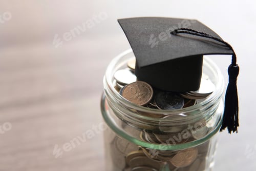 Preview: Glass jar filled with coins and a graduation cap on top of it.