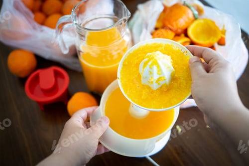 Preview: Summer fresh orange fruit getting squeezed