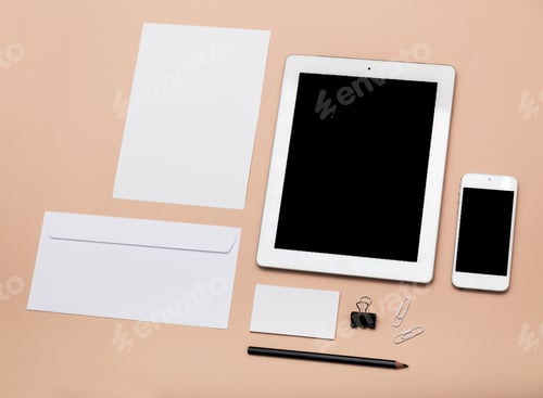 Preview: Modern workspace setup with stationery, tablet, phone, and organizational tools on a soft background