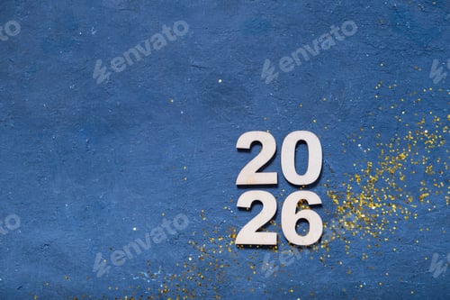 Preview: 2026 New Year celebration decorations featuring wooden numbers and sparkling gold confetti
