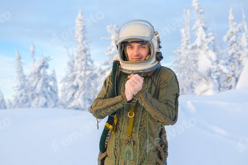 Preview: Pilot Astronaut Is On A Snow-Capped Top. Astronaut In A Protective Suit And Helmet.
