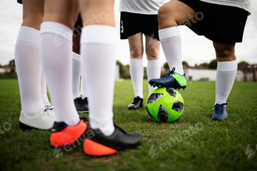 Preview: Group of female football players on the field