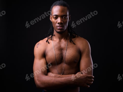 Preview: Young handsome muscular African man with dreadlocks shirtless
